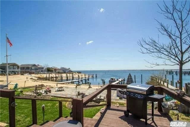 Prime Massapequa Shores Bay Front. Your Own Magical Oasis W/ Panoramic Bay Views. Protected Cove With Your Own Private Sandy Beach. 40&rsquo;+ Pier. Extended Great Room With 9 Ft Slider To A Deck Over Looking Paradise. Downstairs All Brand New Tremendous Family Room- Beautiful Ceramic Floors, New Bath, New Heat System, Finished Part Basement.