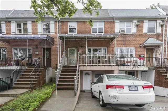 2 Family Brick Attached In Flushing In Mint Condition, All Custom Made Kitchen Cabinets, Closets, Modern Light Fixutes, 3 Zone Heating,  New Radiators, New Gas Heater, 2 Large Balconies, Front Porch, A Must See! Recently Gut-Renovated. Great Investment Opportunity Or Ideal For Large Family.