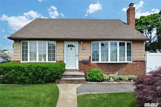 This Lovely Expd Rear Dormered Cape In Desireable N.Hicksville Loc. On Prof.Landscpd Property Features Updt Eik And Bths, Harwd, Ugs, 2 Yr Arch. Roof, Alarmed, Andersens, Wood Burning Fpl, Alarmed. Mrs. Clean Lives Here. A Must See.