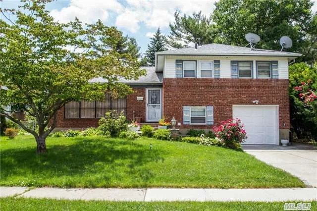 Move Right Into This Brick Split Level In Desirable Field Estates ! This Home Comes With A New Roof, Gas Heating System & Hot Water Heater, Garage Door Along With Exterior Concrete Work. This Spacious Split Also Has A Redone Family Room, Master Bedroom Bath, Hardwood Floors Under The Carpets, Gas Cooking, Garage With Ee, Inground Sprinklers, Finished Basement & More !