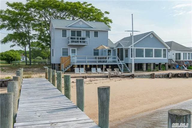 Sandy Beach- Easterly Breezes Off The Water- Every Window Has A Different View! Vacationland At Its Best, Double Waterfront- Double Docks. Panoramic Living Room- 2 Mile Bike Ride To Greenport Village. Central Air, Modern Kitchen- Master Retreat With Balcony. Rare Location And Lifestyle- Beach-Fish-Paddleboard-Sail-Relax....