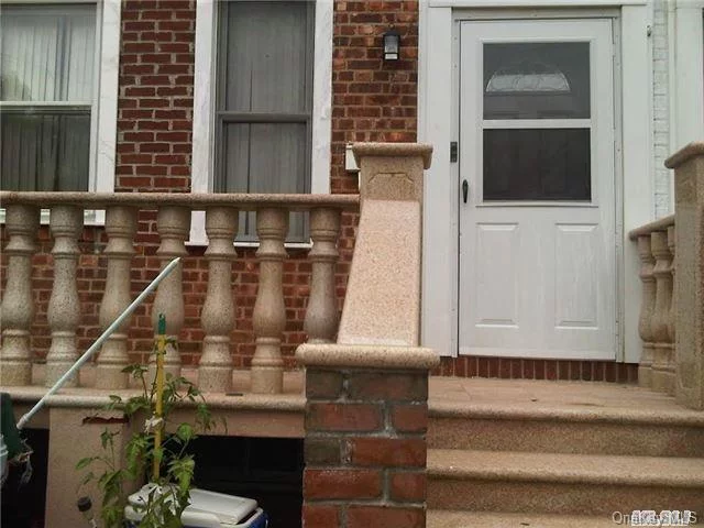 Lovely Brick Townhouse 1st Flr Apt Features Xlarge Lr, Dr, Polished Hw Flrs, Eik W/Dinette Area, Updated Bth, Br, Basement, Large Balcony & Driveway. Walk To Stores, Public Transportation & Lirr. Best Sd#26 Ps31, Ms158, Cardoza Hs, Near Everything!