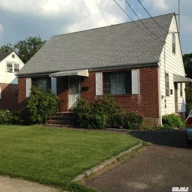 Solid Brick Cape On Lovely Tree Lined Street. 3 Bedrooms With Eat In Kitchen, Living Room, Finished Basement, Full Bath, And H/W Floors. Belgian Block Lined Driveway To Det. Garage. Gate To Lush And Private Backyard. Great Opportunity!