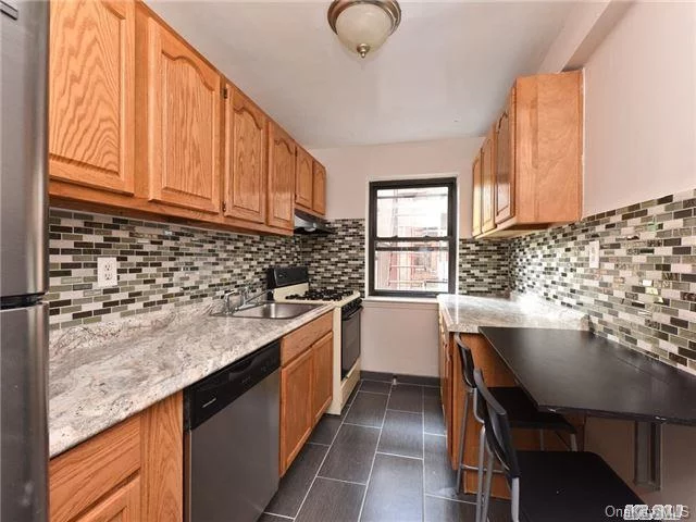 Bright And Spacious, Newly Painted Unit. Renovations Throughout Especially Detailed Upgrades To Kitchen, Bathroom And Wood Floors. Unit Features A Very Large Living Room, Master Bedroom And Foyer. Foyer Can Easily Accommodate A Dinette Table And Shelving Unit. Just Steps To F Train, Queens Blvd; Surface Transportation And Shopping. Great Location.