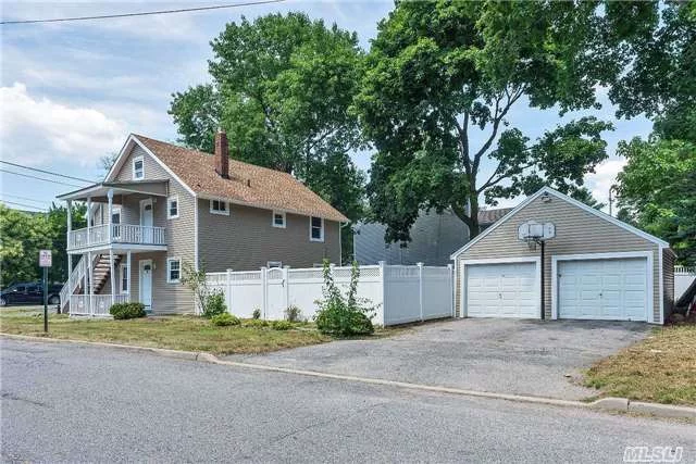 Legal Two Family, Totally Renovated, New Floors, Baths, Kitchens, Fresh Paint, Two Car Detached Garage, Fenced Yard. Great Investment Property.