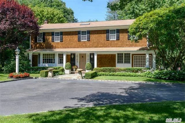 Wonderfully Updated And Maintained Center-Hall Colonial On A Beautifully Landscaped And Serene 2 Acres With A Gunite Pool In Lattingtown. Hardwood Floors And Extensive Custom Cabinetry Throughout The Home. The Eat-In Kitchen And Great Room Open Directly To A Fabulous Deck With Pergola. New Heating And Security Systems. Beach And Golf Privileges(Fee)