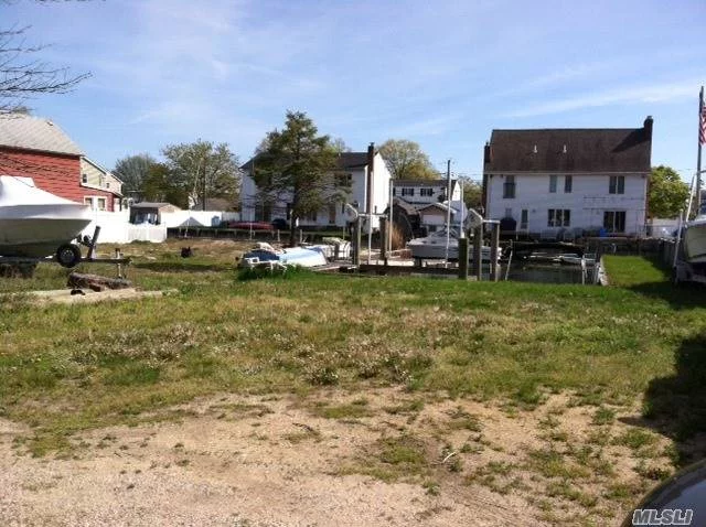 Waterfront Property With Floating Dock. Cleared Land And Ready To Built On. Utilities Are In The Street. Dept. Of Highwat Curb Cut Letter, Old Elevation Records. Survey Attached. The Property Boundaries Are From The Picked Fence Close To House On Left Hand Side, To The Orange Caution String Line.