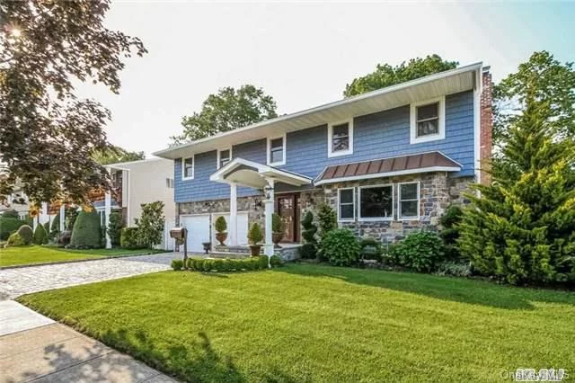 This Renovated, Sunlit Home Offers A Den With Fireplace And Doors To Yard, A Formal Dining Room,  4 Bedrooms , And Central Air. Located Close To Shopping , Dining, And Transportation.