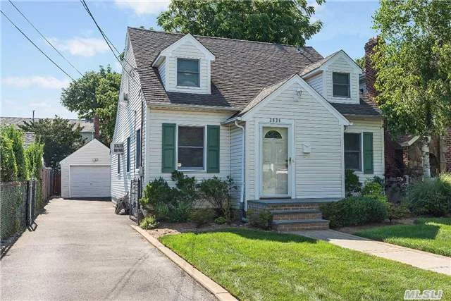 Beautiful Home In The Terrace Section Of Oceanside. Large Entertainers Kitchen Built With Style And Taste, 2 New Bathrooms, Sun Room, Large Backyard Wooden Deck, Fully Finished Basement With Bar,  Close To Shopping, Dining, Lirr And Major Roadways.