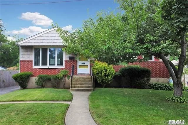 3 Bed 2 Bath Ranch On Tree Lined Dead End Street. Featuring Open Living Room, Formal Dining Room W/ Large Bay Windows, Eik W/Pantry, Large Master Bedroom, Wood Floors Throughout, Large Yard & Cement Patio, Large Basement W/Ose & F/Bath. Walking Distance To East Rockaway Lirr. Shed In Rear Yard.