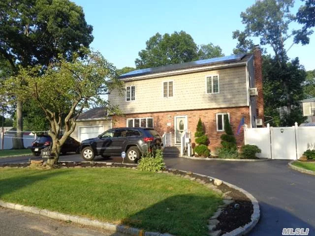 This 4 Bdrm, 3.5 Bath Colonial Has It All. Gleaming Hw Floors, Updated Kitchen And Baths, Updated Siding, Windows, Brick Paver Patio, Upgraded Electrical System,  Beautifully Finished Bsmnt, Legal Studio Apartment (Town Letter Attached). Brand New Solar Panel System Just Installed. Homeowners In Process Of Converting To Gas Heat !!!  Will Continue If Buyers Ok.