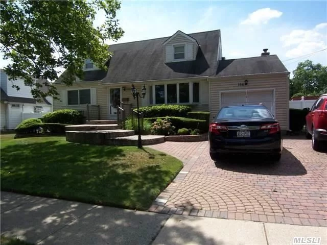 Spacious And Inviting Center Hall Cape. Open Layout With13X32 Extended Kit And Famiyrm/Brick Fireplace, Sliding Doors To Patio, Perfect For Entertaining.4 Bedrooms 2 Baths Fin Basement.2Car Brick Paver Driveway/Walkway/Stoop/With Custom Railings And Lighting.Pvc Fencing. Close To School And Shopping.Poss M/D.