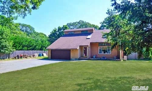 Tucked Away In A Private Setting On An Acre Of Property, This Spacious Home Boasts An Open Floor Plan, 3 Brs, 2.5 Baths, Eik With Maple Cabinets, Sky Lite Great Room W/Fp, Den With Sliders To Backyard Deck, Fin Basement, In Ground Pool, Ductless Air, 2 Car Attached Garage And Much More! East Moriches Schools!