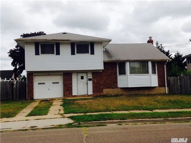 3 Bedroom, 1.5 Bath Split Level House In Need Of Complete Renovation.