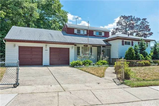 Great 4 Bed Split Level In Massapequa Park For $359, 000. Boasting An Oversized 93X102 Lot With Attached 2 Car Garage, Beautiful Manicured Yard With Patio & Sunroom Extension. A Great Floor Plan With 4 Levels Of Living! Finished Basement With Very High Ceilings, Gas Heating And Cooking & Much More!