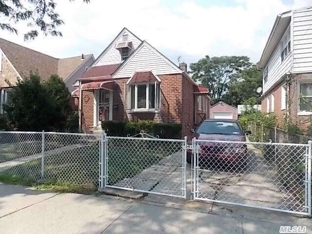 Beautiful Brick Cape In The Heart Of Springfield Gardens. Featuring 3 Bedrooms, 2 Full Baths, Private Driveway With Detached Garage, And Full Finished Basement With Separate Side Entrance. 5 Minutes Away From Major Highways, Jfk Airport, And Shopping.