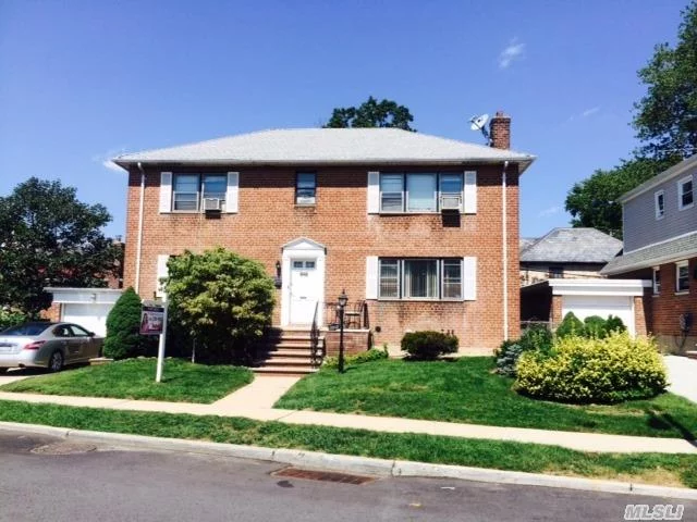 All Brick Legal 2 Family On A Great Block! School District 26. Walk To Lirr, Transportation And Shopping! Spacious Rooms Throughout!