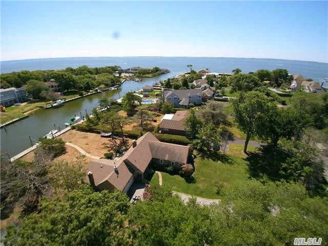 Waterfront, Bayberry Point. Charming 4 Brm Cedar Ranch, 2New Baths W/Italian Tile Wood Flr. & Jacuzzi Tub. 2 Well Positioned Brick Fireplaces Hard Wd Flrs Thru Out,  New Anderson Windows 103&rsquo;Bulkhead, Deep Water Dock W/Boat Ramp.Private Association Bay Front Beach, Junior Sailors Club, Bayberry Tennis Club, Great Family Life Style. High & Dry From Sandy. X Zone Low Flood Ins