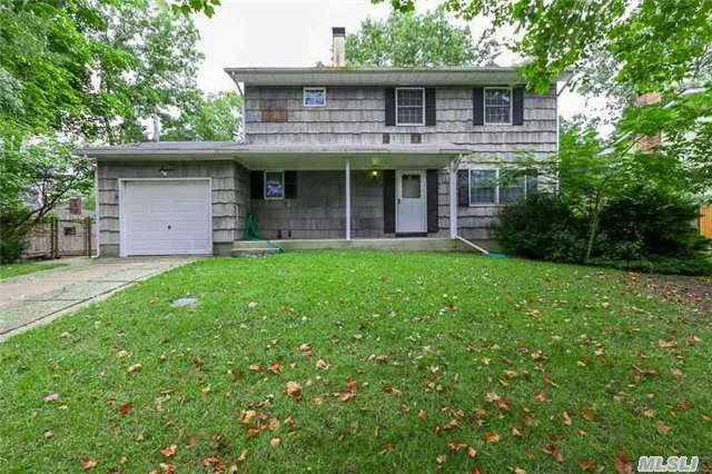 Looking For A Spacious Colonial Home? Do You Have A Paintbrush And A Vision For Your Perfect House? Then This Colonial Will Be For You. Four Bedrooms, One Full And Two Half Bathrooms. Full Basement With Large Windows, One Car Garage, And Large Fenced In Yard.