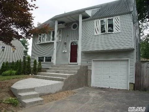 Simply Adorable!!Raised Split With Hardwood Floors Throughout, Updated Kitchen And Bathrooms, Cac,  Deck, Paver Patio & Private Entrance, Fenced, Gas Heat & Roof. Islip Schools A Plus! - Low Taxes. Outside You&rsquo;ll Find A Sizable Deck For Dining Al Fresco Or Nightly Stargazing. Remodeled Bathroom With A Combination Shower/Jacuzzi. Nothing To Do But Move In!! Great Location!