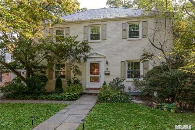 Traditional Walter Uhl Center Hall Colonial In Manhasset Bay Estates. Features Large Living Room W/Fireplace, Formal Dining Room, Eat-In Kitchen, 4 Bedrooms, 3.5 Baths, Cac, Hardwood Floors Throughout.