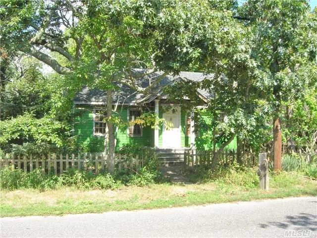 Wonderful Opportunity. Looking For A Home With A Lot Of Potential, This Cape Is Sitting On An Over Sized Lot, Located Minutes From Beaches, Boating, Nature Preserves And Shopping. Home Needs Tlc But Has A Unique Charm And Features Upgraded Electric, Recently Replaced Roof And Some Original Hardwood Floors.