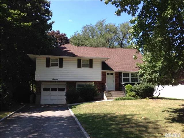 Lovely 4 Br, 2.5 Bath Split On A Beautiful Street, Mid-Block Location. Features 3 Bdrms & Separate Master Suite W/New Bath On The Upper Level. Updated Kitchen & Bath, Hardwood & Ceramic Floors, Gas Cooking, Flat Usable Property. Commack S.D #10, Alarmed.  Easy To Show. Sold As Is!