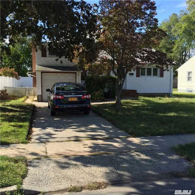 Perfect Starter Home, Great Mid Block Loc, Gas Already In House, 3 Beds, 1Bath, Potential Basement Bath, Wd Floors, Full Size Base W/Ose, Full Size Garage, Spacious Yard, Close To All-Lirr-Shopping-Restaurants-Parks-House Of Worship, Too Much To List, East To Show!!