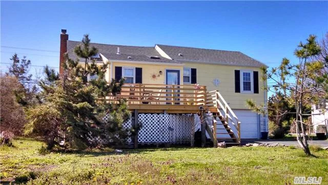 Enjoy Beach Living Year Round With The Warm Comforts Of Home In This Spacious 2-Story. Wood Floors, Wood Burning Fireplace. Sunny Interiors Open To North And South Facing Decks. Unfurnished.