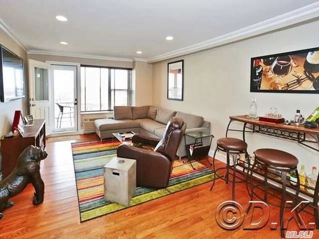 Diamond Condition Genuine 2 Bedroom Corner Unit W/ Terrace & Parking! Brand New Granite Kitchen, New Tile Bathroom, Hardwood Floors, Crown Moldings & Custom Closets Galore. Beautiful New Wooden Doors Add Luxurious Feel. Just Steps From The Beach! Cat Friendly Bldg. Features Gym, Bbq Area, Bike Room & Beach Chair Storage. Maintenance Includes Heat, Gas, Water & Taxes.