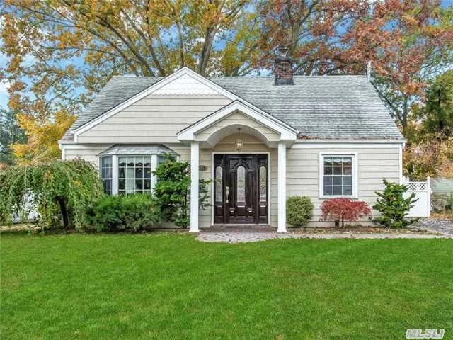 Updated Dormer Cape In Massapequa Woods. Absolutely Nothing To Do. Open Floor, Lrg Living Room/Dining Area That Features French Doors Into Stunning Yard. Gas Stove, Oil Heat, Cac, Deck, Park Like Grounds, Newer Windows, Doors, Siding, Driveway & Walkway, Sheetrock, Tile, Carpets, Baths, Kitchen, Roof & Deck. Serene And Quiet Block. Commuters Delight. Close To Railroad.