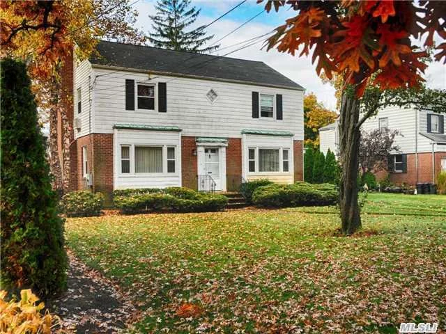 Gracious & Spacious Center Hall Colonial Offers Open Floor Plan .Lovely Living Rm W/Fpl, Huge Formal Dining Rm, Charming Den, Master Br W/2 Double Closets & Bath, New Hall Bath.Private Grounds, Convenient To All. Sd#25 (Merrick Ave Middle Sch & Jfk High School). Walk To Houses Of Worship & Lirr.Flood Ins. Not Required. Updated Heating System; Roof.