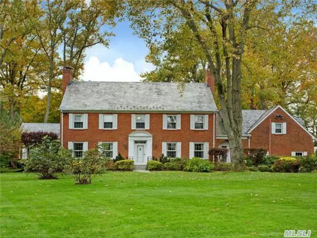 Exceptional Brick Colonial Set On A Beautifully Landscaped, Rare 1.34 Flat Acre Parcel. This Elegant And Traditional Residence Offers Spacious, Sun-Drenched Principle Rooms. Living Room With Fireplace, Formal Dining Room With Fireplace, Paneled Library, Eat-In Kitchen, Screened Porch, 5 Br, And 5 Bths, 1st Fl Laundry, Rear Staircase, Walk-Up Attic, 2-Car Garage.