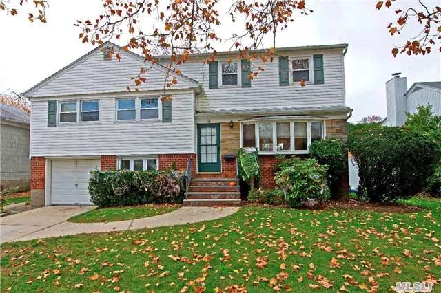 Expanded And Beautifully Updated 4 Bedroom Split On A Quiet Mid Block Location Near Town, Long Island Rail Road And Highways...Commuters Dream! Custom Wood Granite And Ss Eik, Wood Floors Through-Out, Cac & All Set On A Perfect Private Fenced Parcel With Deck And Retractable Awning. Must See!!! ****Taxes Have Just Been Reduced By $ $4768.****