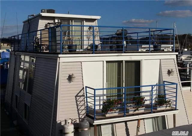 Largest Houseboat Updated 4 Years Ago With 3 Bedrooms, 2 Baths (Jacuzzi) , Kitchen W/Granite Countertop, F/D/R, Oak Floors, New Andersen Windows, 2 F/P, 2 X100 Propane Tanks. $250/Month Allowance For Electric. Huge Deck On Upper Level For Entertainment!