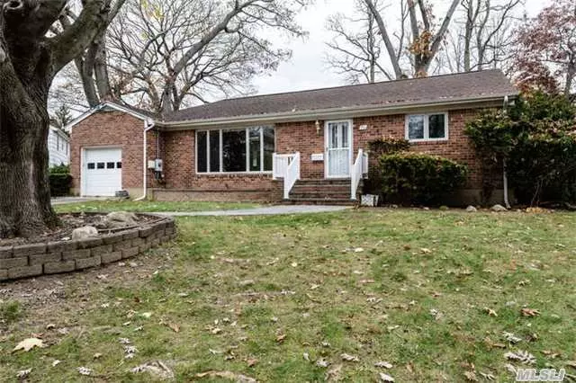 Lovely Brick Ranch On Oversized Fenced Property. Spacious Living Room Overlooking Front Yard. Updated Kitchen W/ Dining Room. 2 Bedroom, Renovated Bathroom, Office, Laundry Room, New Anderson Windows. Full Basement. Large Wood Deck, Attached 1 Car Garage. Oil Heat, Tank In Basement. Cac, New Cesspools.