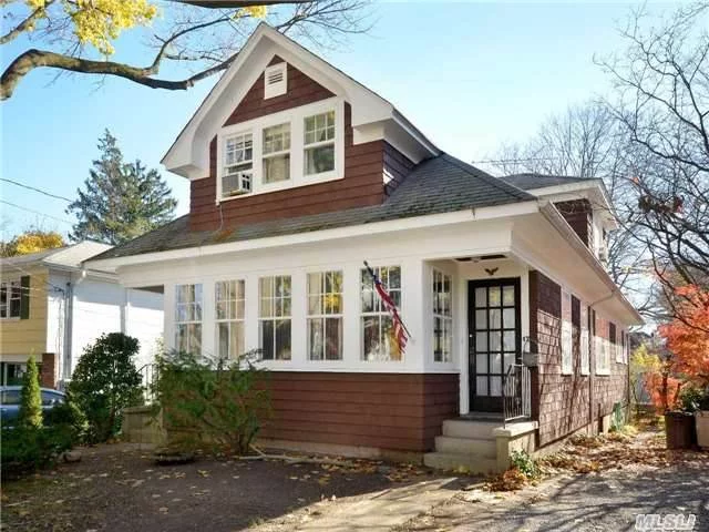 Charming Craftsman Home Nestled On A Quiet Tree-Lined Street. Perfect Starter Home With Legal Rental. Many Original Details Throughout. North Shore Schools, Beach Privileges.