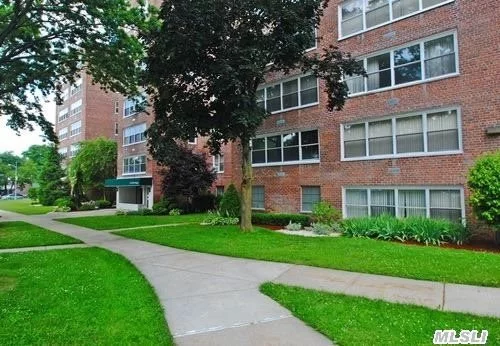 Largest Corner 1200 Sq. Ft. 2 Bedroom W/2 Baths And Reserved Parking./2nd Parking Spot Available. Located In The Heart Of Bay Terrace. Freshly Painted, Hardwood Floors Through Out./ Central Air/Heat. .Express Bus To City And Flushing Right Outside Your Door. Minutes To The Lirr -walk To Bay Terrace Shops,  Top S.D#25.
