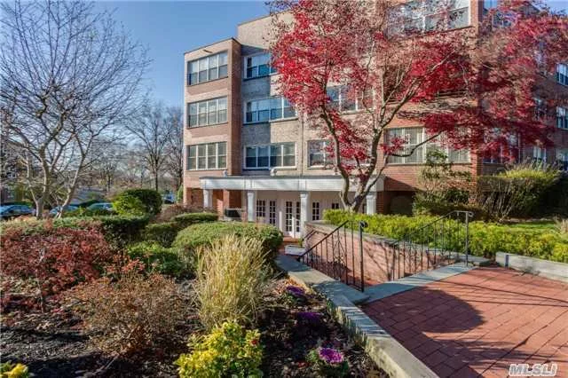 Large Renovated 2 Bedroom 2 Bath Unit In The Prestigious Executive House Hardwood Floors, Gym, Sauna, Party Room , Laundry On Each Floor, Terrace, Loads Of Closets Including Walk In In Master . Convenient To Lirr , Higways And All Transportation