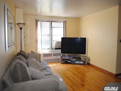 Sunny Ground Floor Corner Apt. With Windows In All Rooms. Faces Garden, Quiet Neighborhood. Near Bus Lines, Supermarket. School District 26. Easy Commute To Nyc Express Bus Qm5, Qm8, Q17, Q75 Andq88 Convenient To All !!! Corner Unit , Lower Level, Windows In All Rooms. Income Req - 55K For 1, Couple 80K. 20% Down. 28% Debt To Income Ratio