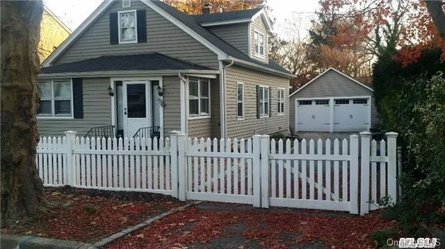 First Floor Picture Perfect 2 Br Apartment On A Quiet Lane In Historic Sea Cliff! Living Room, Formal Dining Room,  Kitchen, 2 Bedrooms, Full Bath, Fenced In Yard, Deck, Driveway/Garage. Hardwood Floors, Enclosed Porch With Possible Office, Immaculate. North Shore Schools, Beach Privileges.