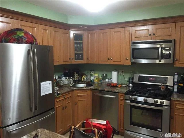 Spacious 2 Br, 1.5 Bath On 1st Floor Of Private House. Includes Heat & Hot Water Plus 1 Parking Space In Driveway And Use Of Half Of Garage For Storage. Kitchen Has Ss Appliances And Includes A Microwave.