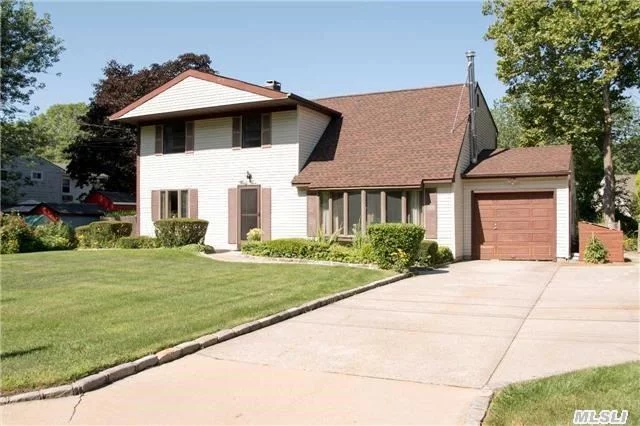 Fabulous 4/5 Bedroom Colonial W/Legal Accessory Apartment! Oak Kitchen Cabinets W/Ceramic Tile, Andersen & Marvin Wndws, Hi Hats, Coal Stove, Cac, Whole House Alarm, Full Fin Bsmt, Updates Include: New Cesspool, New Roof, & New Floors, Whole House Alarm, Beautifully Landscaped Fully Fenced .35/Acre W/In-Ground Sprinklers, Middle Country Sd, A Must See!