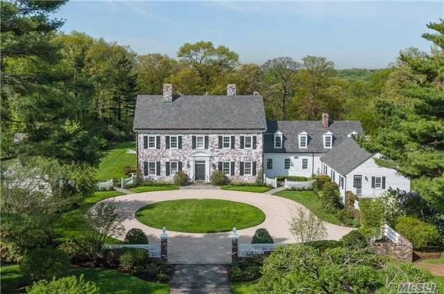 Fabulous 1936 Federal Style White Washed Brick Manor Home Designed By Kimball & Husted On 6+ Private Acres Of Sweeping Lawns & Woods. Original School House, Where Walt Whitman Taught, Was Moved To The Property From Huntington. House Was Completely Renovated In 2007 Retaining The Old World Details And Charm.