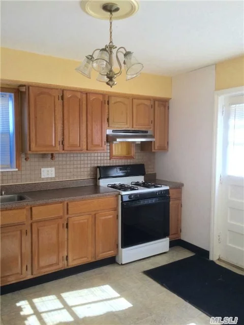Mint 2 Br Apartment With Small Backyard And Separate Entrance. Apartment Offers Eat-In-Kitchen And Beautiful H/W Flooring.