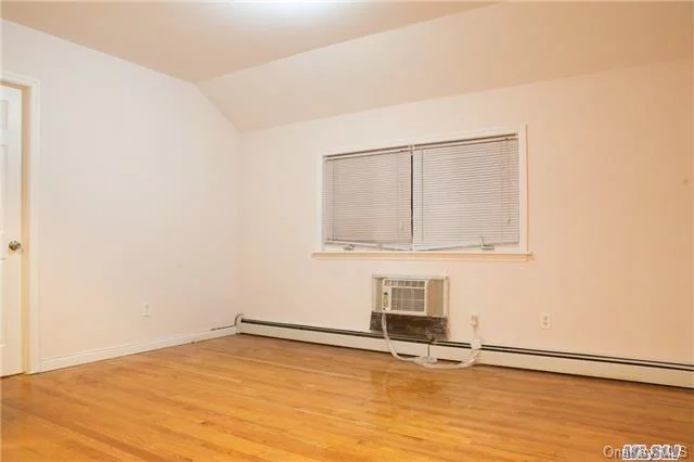 Brightly Renovated Apartment With Hardwood Floors Throughout. Bedroom Features A Balcony, Plus Extra Room, And Both Rooms Equipped With Ductless Units For Heat And A/C. Easy Walk To Bayside Lirr, Easy Street Parking, And Just A Short Drive To All Major Highways. Ideal For 1-2 People Max. Will Not Last, Call Today To Schedule Your Showing!