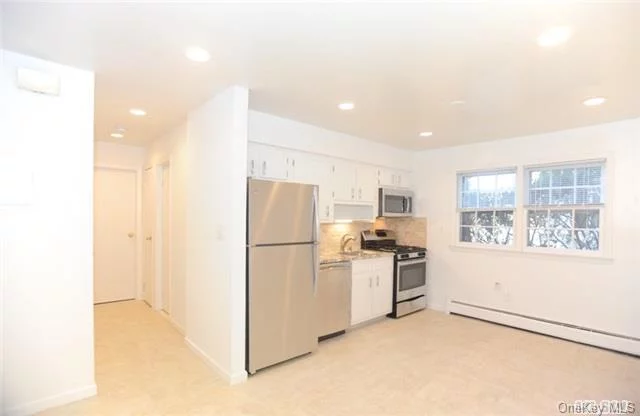 Newly Renovated Legal Two Family Near Roslyn Village** Floor To Ceiling Renovation, New Tiles, Hi-Hats, New Windows, New Blinds, Bamboo Floors, New Ss Appliances, New Bath, Garage, Outdoor Patio, Separate W/D. Close To Village, Theatre, Restaurants, Roslyn Park, Easy Commute.