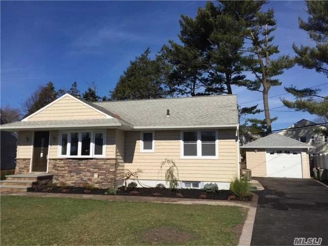 Beautifully Renovated With Open Floor Plan, Granite Kitchen,  2 Full Baths, Ceramic Tile Finished Basement, , Central Air, New Walks & Drive, New Oak Flooring. Sliders To Deck, All New Windows , Doors, Etc. Siding And Stone Exterior, . Jacuzzi Tub, 200 Amp Svc, Garage,  Renowned Syosset Schools.