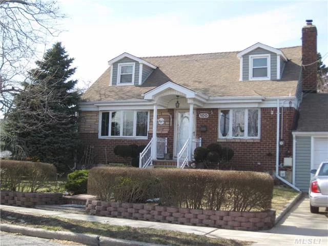 Well Maintained Rear-Dormered Cape On Over-Sized Property Features Eat In Kitchen With Gas Cooking Open To The Dining Room, Hardwood Floors, Large Finished Basement, Updated Windows, Crown Molding. 2 Year Young Roof. 3 Bedrooms, 2 Full Bathrooms. Inground Sprinklers, Beautiful Perenial Gardens. Super Clean. Close To All!