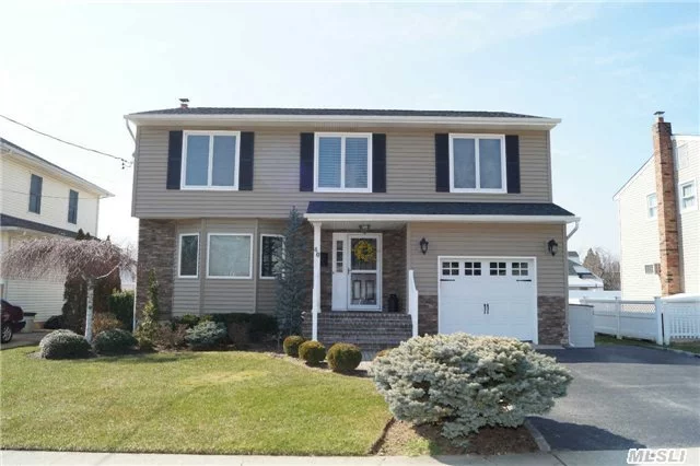 Move Right In To This Beautiful Colonial - Mid-Block Location On Nice Wide Street. Lr, Formal Dr,  Eik, Den W/Tiled Hardwd Flrs, 1/2 Bth & Pella Sliding Doors To Deck, Master Br W/Fbth, 3Brs, Fbth, Finished Basement W/Custom Mouldgs, 1/2Bth & 60Mountd Tv & Sound System Tha W/Stay. New Siding, New Roof, Andersen Windows.